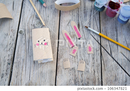Kids craft bunnies out of recycling toilet paper roll, zero waste concept. Step by step instruction - 5 Kids craft bunnies out of recycling toilet paper roll, zero waste concept. Step by step instruction - 5 106347821