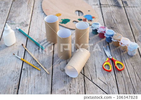 Kids craft bunnies out of recycling toilet paper roll, zero waste concept. Step by step instruction - 1 106347828