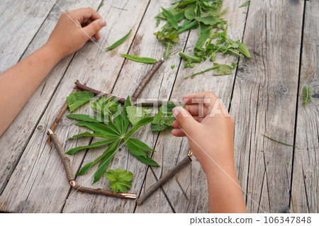 Summer crafts apple made from green leaves and dry sticks. DIY. The development of imagination. step by step 106347848