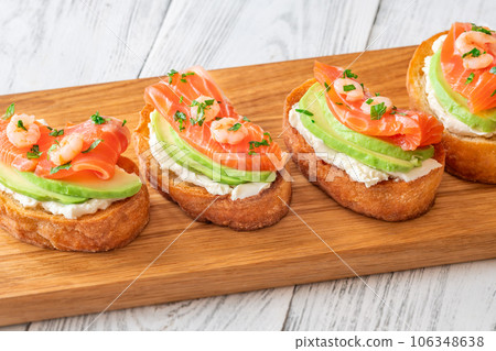 Sandwiches with avocado and salmon Sandwiches with avocado and salmon 106348638