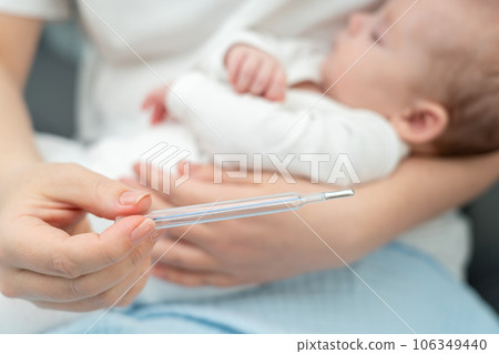 Mother checks newborn's temperature, Concept of healthcare at home Mother checks newborn's temperature, Concept of healthcare at home 106349440