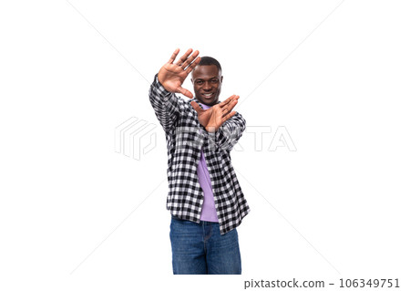 stylish young american guy with short haircut dressed casually on white background with copy space 106349751