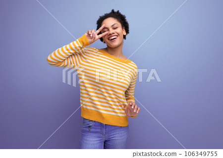 brunette latin young woman with porous hair in studio background brunette latin young woman with porous hair in studio background 106349755