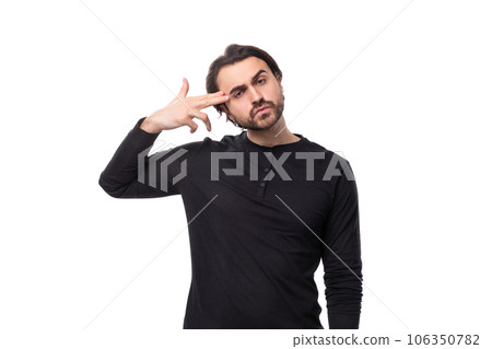 close-up portrait of a young 30 year old doubting bearded well-groomed brunette with a chic stylish 106350782