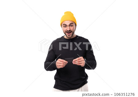 smart authentic brunet male adult in a black sweater talks about an idea on a white background with smart authentic brunet male adult in a black sweater talks about an idea on a white background with 106351276