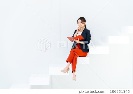 businesswoman sitting on stairs businesswoman sitting on stairs 106351545