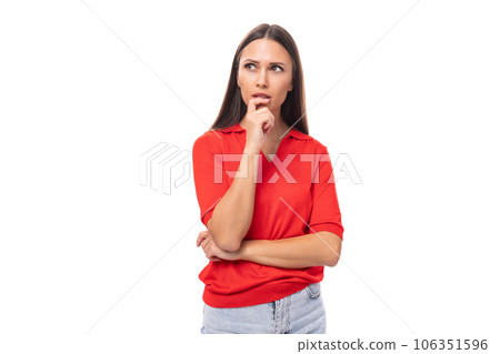 young beautiful caucasian brunette in a red short sleeve shirt on a white background with copy space young beautiful caucasian brunette in a red short sleeve shirt on a white background with copy space 106351596