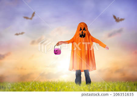 Kids in witch costume on Halloween trick or treat 106351635