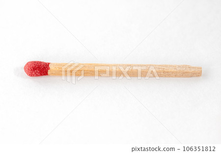 Red match stick on white background. 106351812