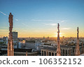 As the sun begins its descent below the horizon, the city of Milan undergoes a breathtaking transformation 106352152