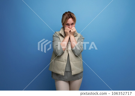 indignant sad blonde young millennial woman on studio background indignant sad blonde young millennial woman on studio background 106352717