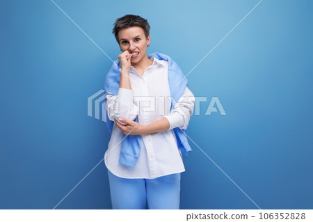 upset pensive young dark haired woman with short haircut upset pensive young dark haired woman with short haircut 106352828