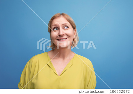 portrait of a funny middle-aged woman with a bob hairstyle with a grimace 106352972