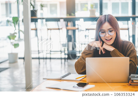young student wearing headphones studies online, distance learning, and keeps up to date on the global coronavirus pandemic.. young student wearing headphones studies online, distance learning, and keeps up to date on the global coronavirus pandemic.. 106353324