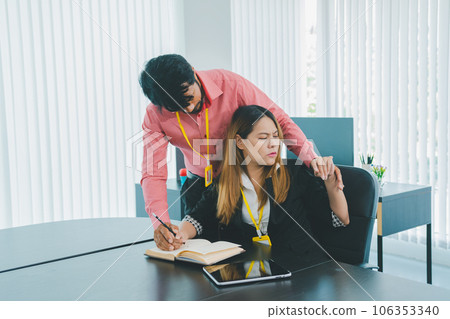 Boss or supervisor touching female employee's shoulder Causing young employees to resist because they are uncomfortable and afraid of being sexually abused. Concept of sexual harassment in the 106353340