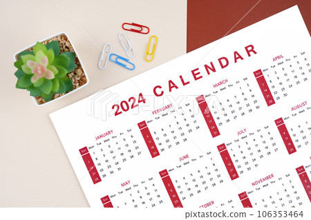 The Calendar 2024 page with paper clip and plant pot on beautiful background. 106353464
