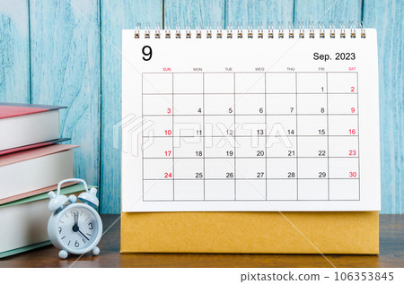 The September 2023 Monthly desk calendar for the organizer to plan 2023 year with alarm clock and books on wooden table. The September 2023 Monthly desk calendar for the organizer to plan 2023 year with alarm clock and books on wooden table. 106353845