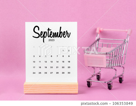 The September 2023 Monthly calendar with shopping cart against pink background. The September 2023 Monthly calendar with shopping cart against pink background. 106353849