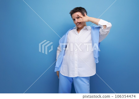 stylish young brunette woman with short haircut in white shirt stylish young brunette woman with short haircut in white shirt 106354474
