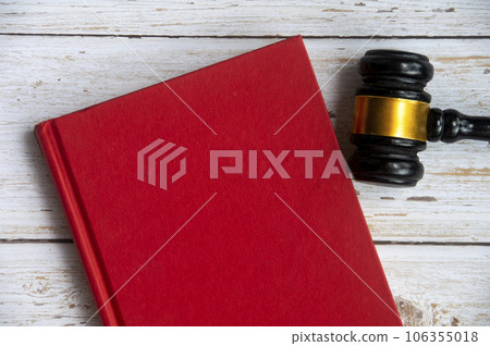 Top view of empty cover red book with gavel. Top view of empty cover red book with gavel. 106355018