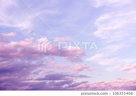 Sunrise Light Pink and Purple Clouds on Blue Sky 106355408