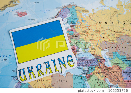 Bangkok, Thailand February 7, 2022, Ukraine flag symbol on world map background. Bangkok, Thailand February 7, 2022, Ukraine flag symbol on world map background. 106355736