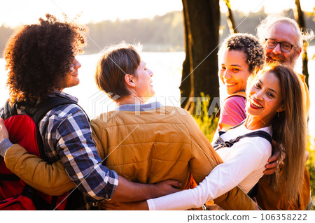 Unity in Diversity: Young Adventurers Embrace Sunset's Beauty 106358222