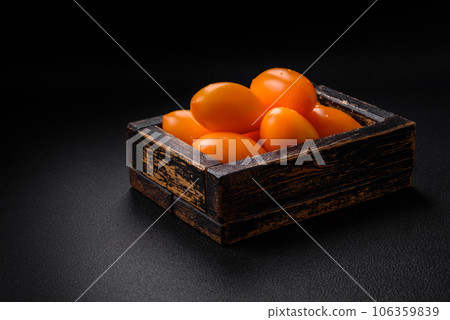 Bright juicy fresh yellow plum-shaped tomatoes. Preparing the tomato sauce Bright juicy fresh yellow plum-shaped tomatoes. Preparing the tomato sauce 106359839