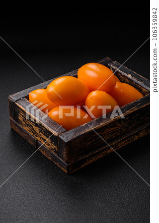 Bright juicy fresh yellow plum-shaped tomatoes. Preparing the tomato sauce Bright juicy fresh yellow plum-shaped tomatoes. Preparing the tomato sauce 106359842