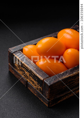 Bright juicy fresh yellow plum-shaped tomatoes. Preparing the tomato sauce 106359844