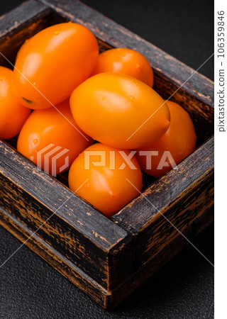 Bright juicy fresh yellow plum-shaped tomatoes. Preparing the tomato sauce Bright juicy fresh yellow plum-shaped tomatoes. Preparing the tomato sauce 106359846