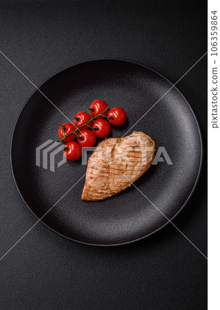Delicious juicy grilled chicken fillet with salt, spices and herbs 106359864