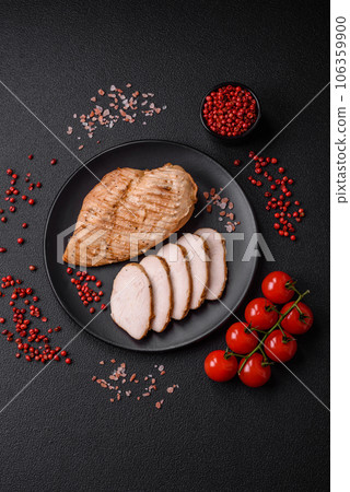Delicious juicy grilled chicken fillet with salt, spices and herbs Delicious juicy grilled chicken fillet with salt, spices and herbs 106359900