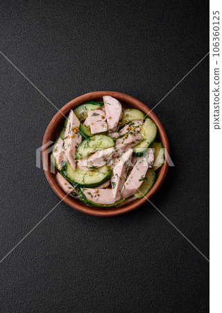 Delicious juicy fresh salad of cucumbers and grilled chicken slices, with french mustard Delicious juicy fresh salad of cucumbers and grilled chicken slices, with french mustard 106360125