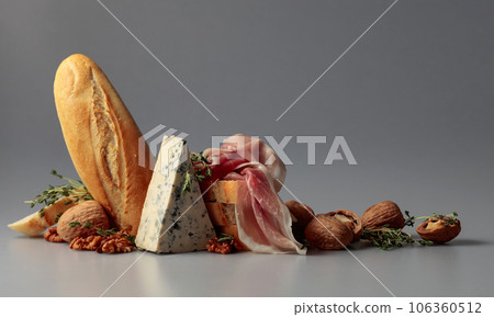 Prosciutto with blue cheese, baguette, walnuts, and thyme. Prosciutto with blue cheese, baguette, walnuts, and thyme. 106360512