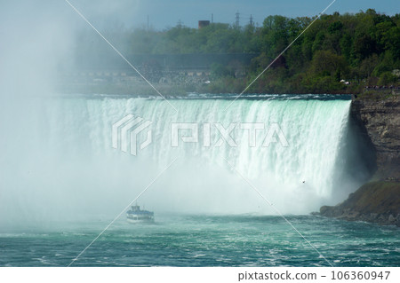 NIAGARA FALLS, ONTARIO, CANADA - MAY 20th 2018: Touristic boat on Horseshoe Falls, also known as Canadian Falls 106360947
