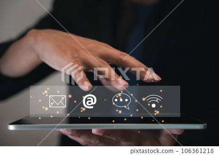 Contact us or e-mail marketing concept on tablet, highlighting customer support hotline connections. Icons of email, phone call, and address represent communication. Banner online company interactions Contact us or e-mail marketing concept on tablet, highlighting customer support hotline connections. Icons of email, phone call, and address represent communication. Banner online company interactions 106361218