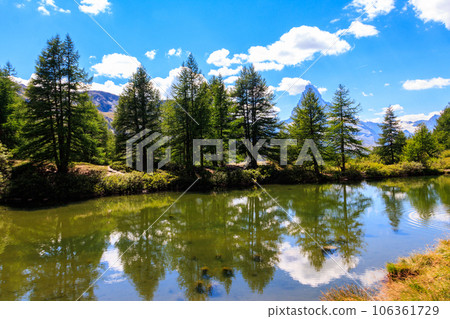 View of Grindji Lake (Grindjisee) and Swiss Alps at summer on Five-lake trail in Zermatt, Switzerland 106361729