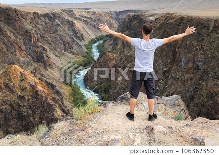 Man travels through the national parks of Central Asia, he is delighted with the nature of Kazakhstan Man travels through the national parks of Central Asia, he is delighted with the nature of Kazakhstan 106362350