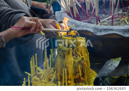 Asian people praying at Ayutthaya ruins, at Wat Phra Si Sanphet temple. Asian people praying at Ayutthaya ruins, at Wat Phra Si Sanphet temple. 106362685