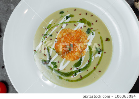 Spinach soup with croutons in white bowl Spinach soup with croutons in white bowl 106363084