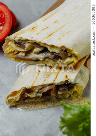 Shawarma sandwich gyro fresh roll of lavash chicken beef shawarma falafel RecipeTin Eatsfilled with grilled meat mushrooms cheese. Traditional Middle Eastern snack 106363099