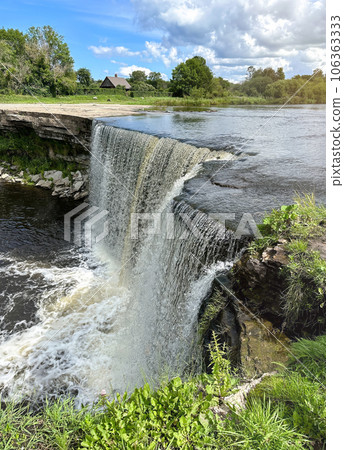 A beautiful big waterfall in Estonia on a clear sunny day A beautiful big waterfall in Estonia on a clear sunny day 106363333