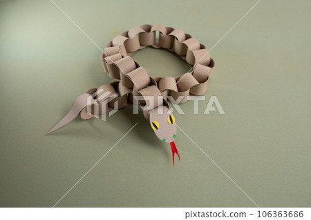 a snake made out of toilet paper rolls, craft made of recycle cardboard, DIY 106363686