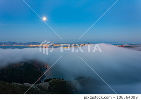 Twilight aerial view of the Golden Gate Bridge with fog 106364099