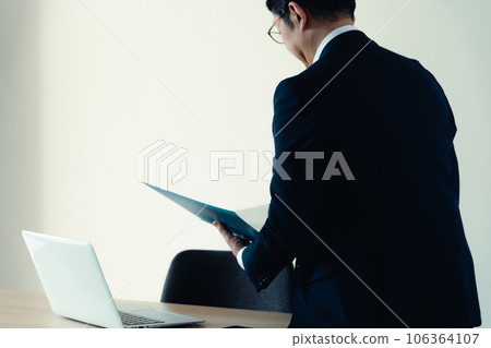 Businessman working in a depressed mood 106364107