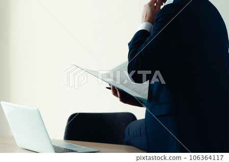 Businessman working in a depressed mood 106364117