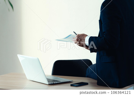 Businessman working in a depressed mood Businessman working in a depressed mood 106364121