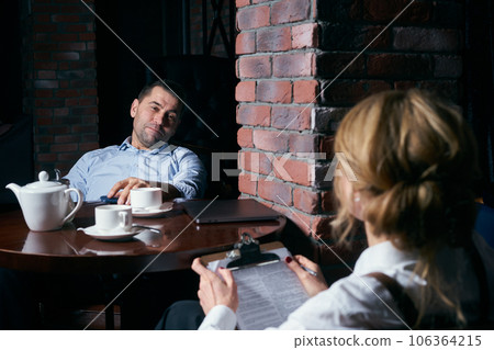 Happy business people working together on laptop in a restaurant 106364215