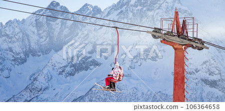 People are lifting on skilift in the mountains People are lifting on skilift in the mountains 106364658